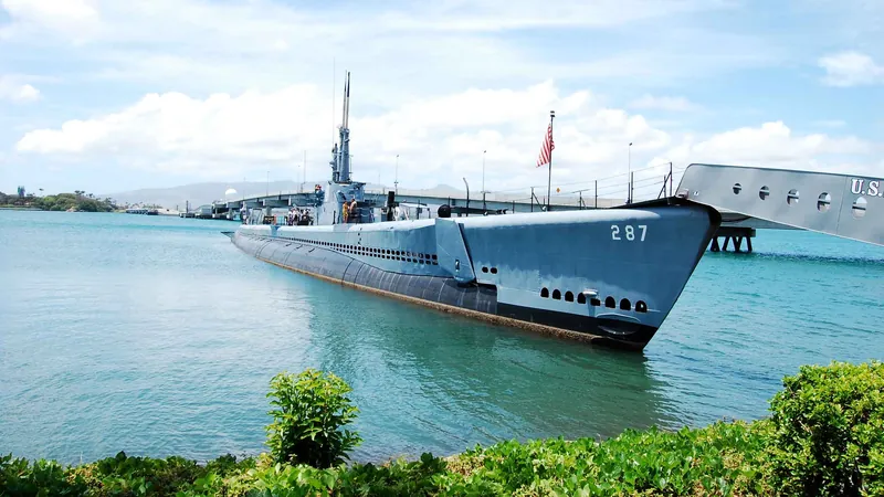 Battleship Missouri and Ford Island hangars on a full-day Pearl Harbor tour from Honolulu, illustrative scene