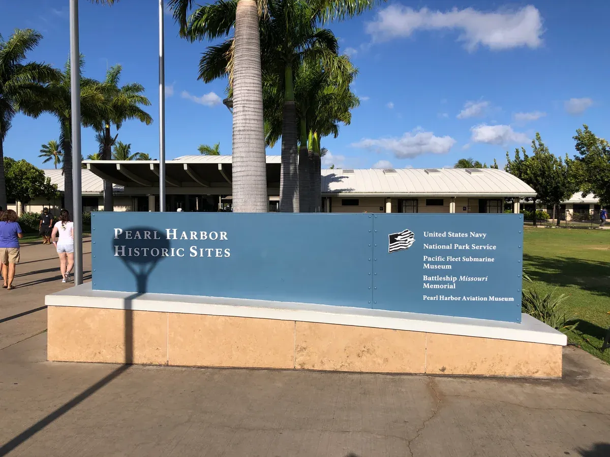 Pearl Harbor Historic Sites sign at the visitor center where Pearl Harbor tours from Honolulu stop