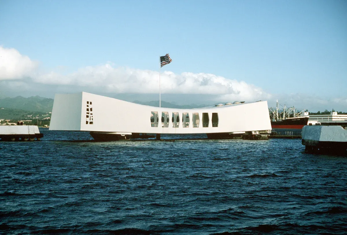 The USS Arizona Memorial seen from the water, the stop on every Pearl Harbor tour from Honolulu